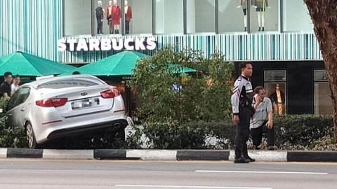 Taxi mounts Orchard Road pavement in early morning accident
