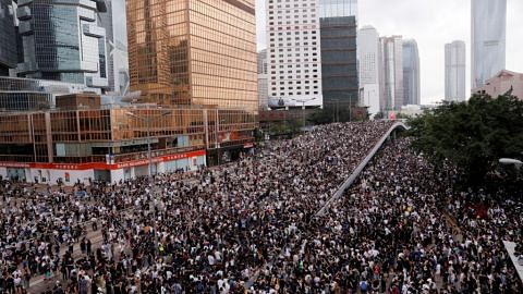 Hong Kong delays debate on extradition Bill as thousands of protesters block key roads