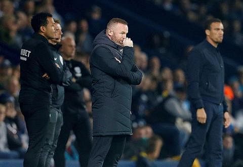 PIMPIN PASUKAN BARU: Rooney (tengah) meletakkan jawatan sebagai pengurus Derby County pada hujung Jun setelah kelab itu disingkirkan dari Liga Championship. - Foto fail