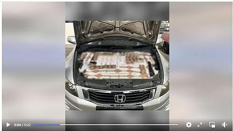 PATAHKAN USAHA MENYELUDUP: Rokok tidak dibayar cukai telah ditemui antaranya di kawasan bonet kereta Honda di Pusat Pemeriksaan Woodlands pada April. - Foto FACEBOOK ICA