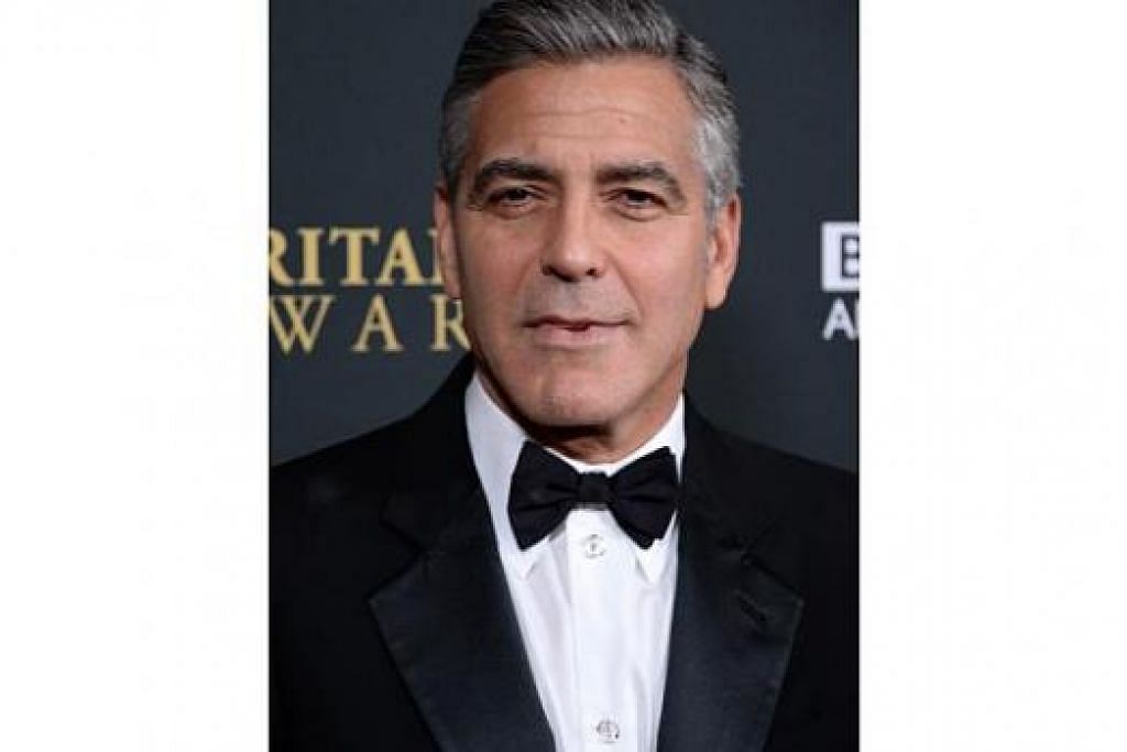 TAK SABAR: George Clooney teruja menimang anak kerana yakin bakal isterinya, Amal Alamuddin, akan menjadi ibu yang baik. - Foto AFP