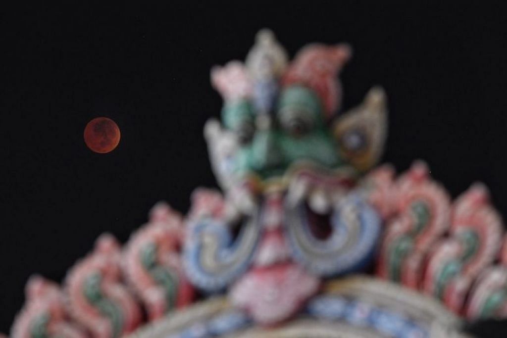 Lunar eclipse: Stargazers in Singapore catch century's longest 'blood moon'