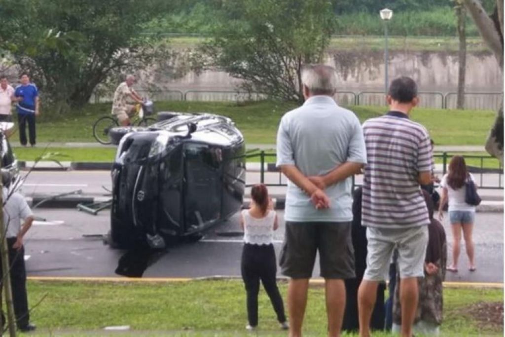 Car overturned, 3 including cabbie injured after accident at Hougang