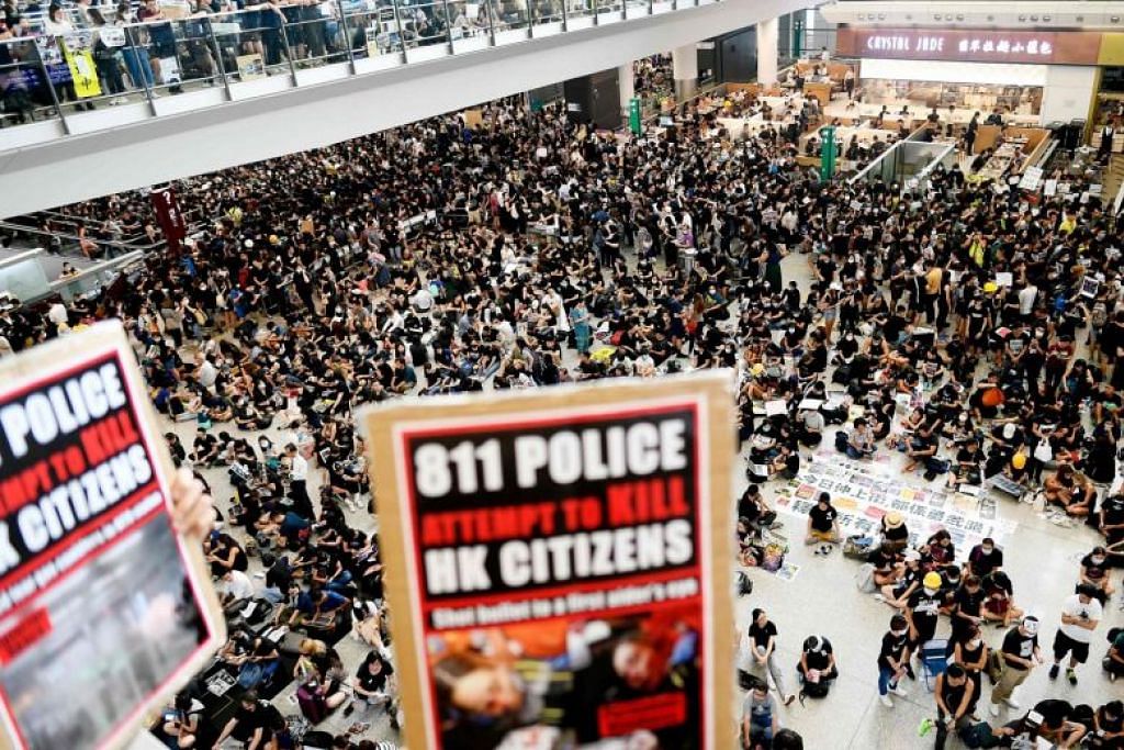 Hong Kong cancels all remaining Monday flights as protesters swarm airport