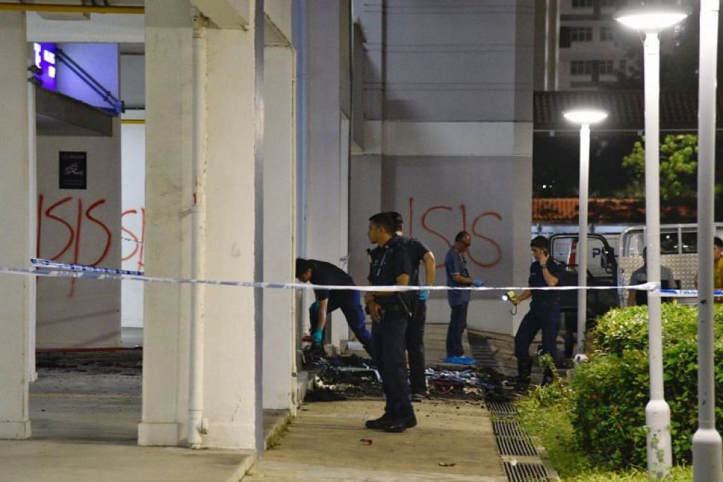 Man detained over fire, 'ISIS' graffiti outside police post in Boon Keng