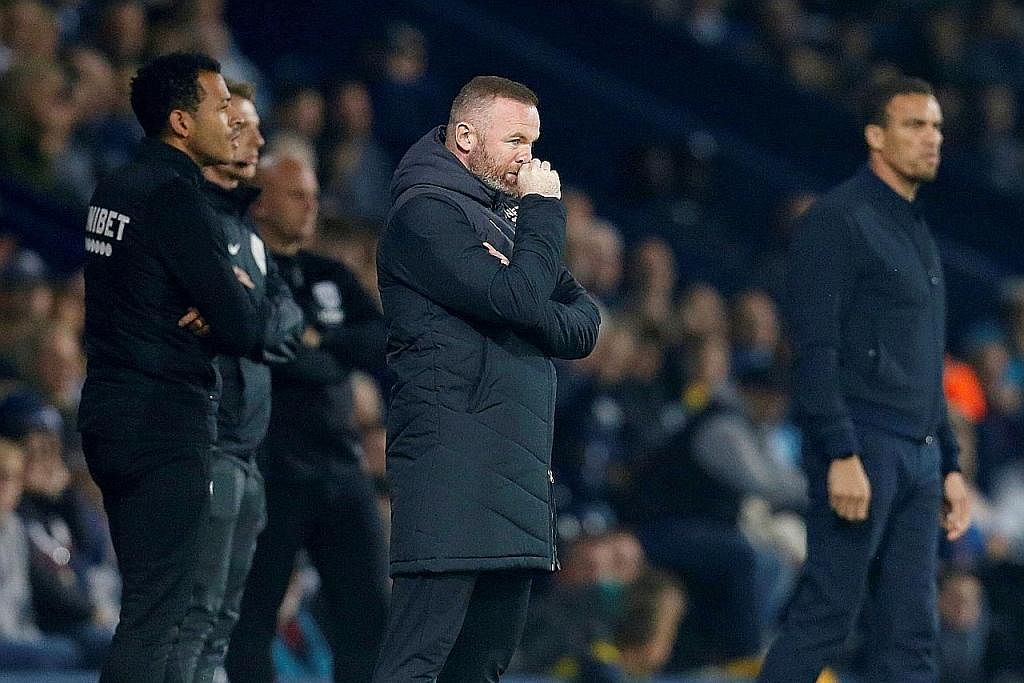 PIMPIN PASUKAN BARU: Rooney (tengah) meletakkan jawatan sebagai pengurus Derby County pada hujung Jun setelah kelab itu disingkirkan dari Liga Championship. - Foto fail
