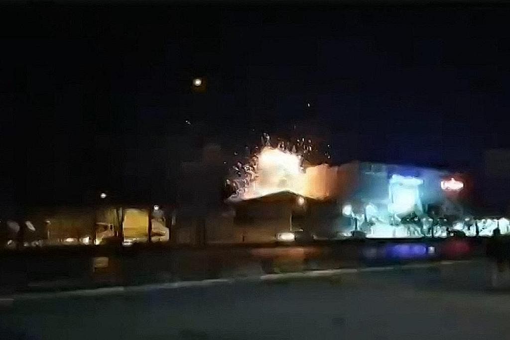 DISERANG: Gambar yang diambil daripada video UGC menunjukkan letupan di wilayah Isfahan, Iran yang dipercayai akibat serangan dron. - Foto AFP