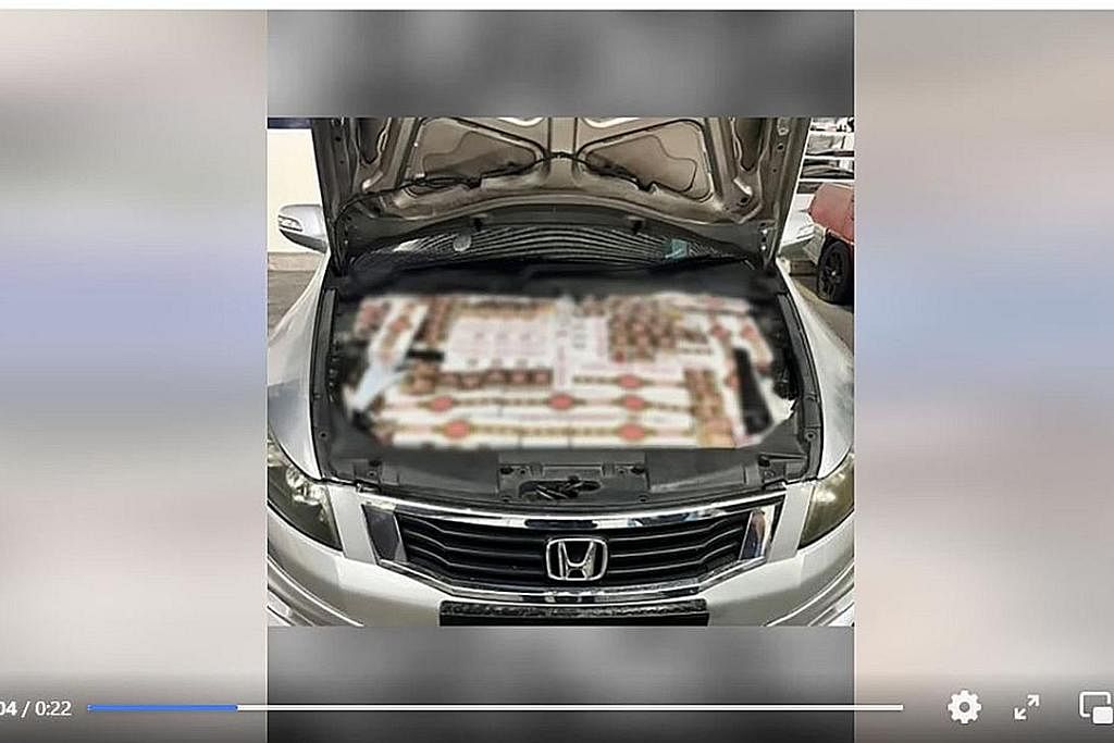 PATAHKAN USAHA MENYELUDUP: Rokok tidak dibayar cukai telah ditemui antaranya di kawasan bonet kereta Honda di Pusat Pemeriksaan Woodlands pada April. - Foto FACEBOOK ICA